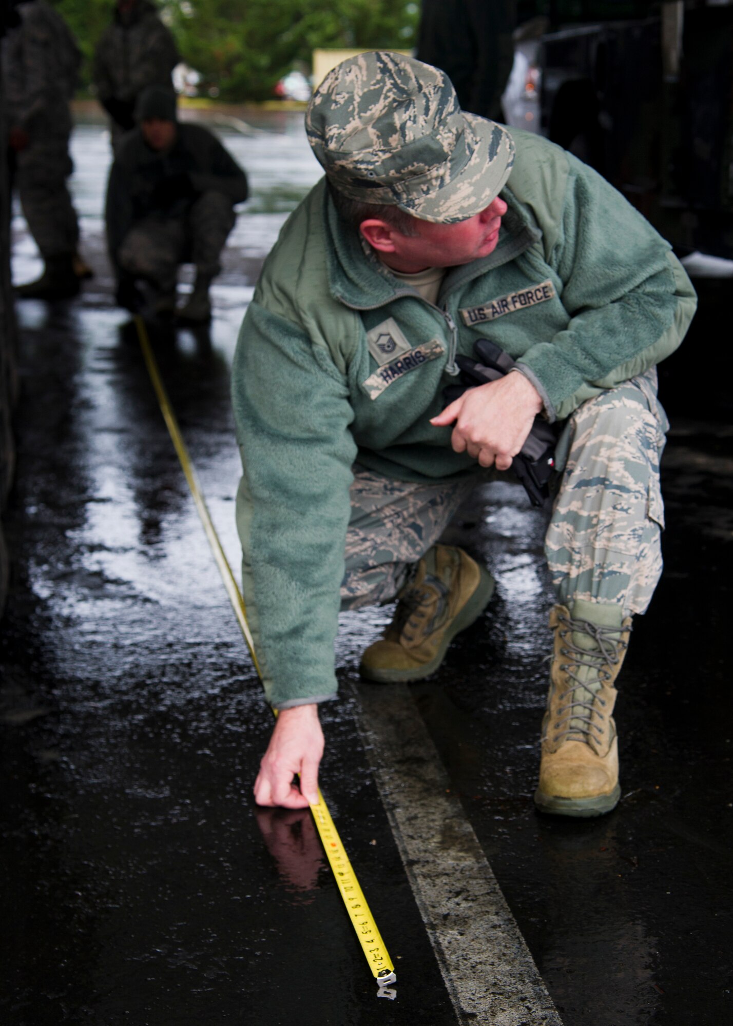 36th Aerial Port Squadron Airmen use a tape measure to take dimensions of an M1136 Stryker combat vehicle before loading it onto a C-17 Globemaster III at Joint Base Lewis-McChord, Dec. 6. The 36th APS out of McChord Field helped to train the U.S. Army’s 301st Maneuver Enhancement Brigade on preparing a Stryker for transport in a C-17 Globemaster III. (U.S. Air Force Reserve photo by Senior Airman Daniel Liddicoet)