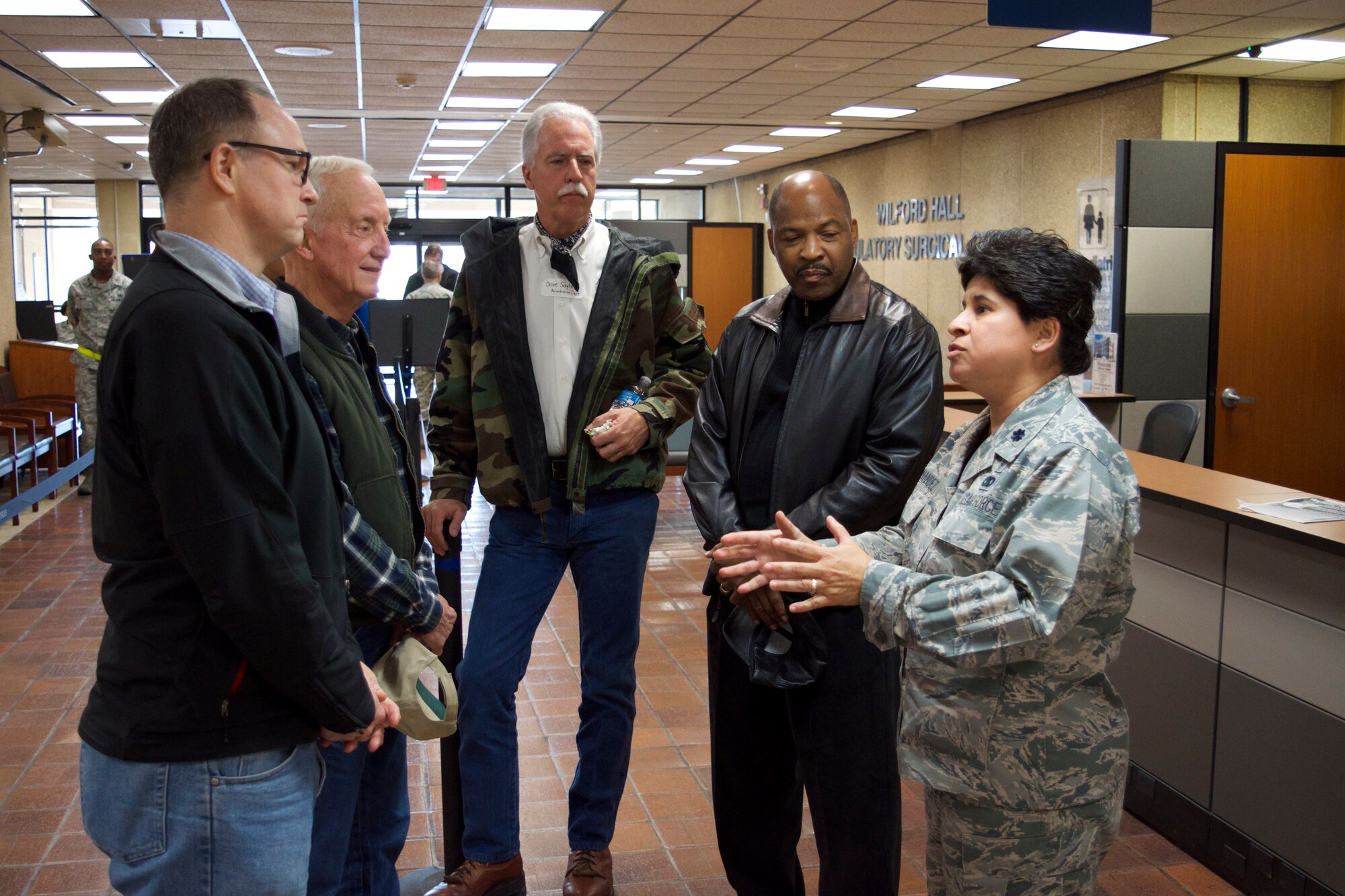 Lt. Col. Silvia Fernandez, 433rd Aerospace Medicine Squadron senior administrator, briefs a group of the 433rd Airlift Wing honorary commanders before the tour of the 433rd Medical Group on Joint Base San Antonio-Lackland, Texas on Dec. 5, 2015.  Ten honorary commanders were in attendance for the final tour of 2015.  The members toured both the 433rd MDG and 433rd OG. (U.S. Air Force photo/Senior Airman Bryan Swink)