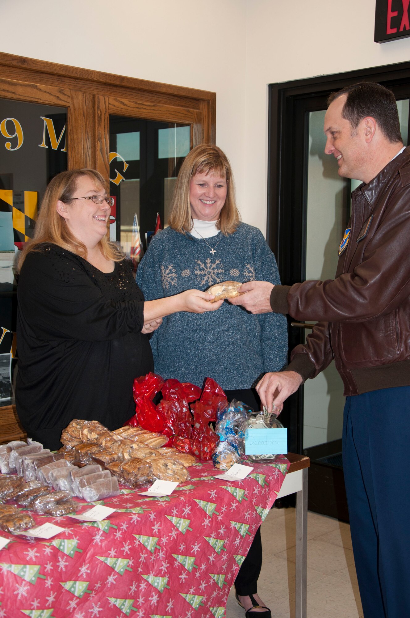 The 459th Air Refueling Wing Airman and Family Readiness Center partnered with the Key Spouse Program to host the 6th annual bake sale on Dec. 5th, 2015 to raise money for Airmen in need this holiday season. The event raised close to $1,000 dollars. (U.S. Air Force photo/Senior Airman Kristin Kurtz)