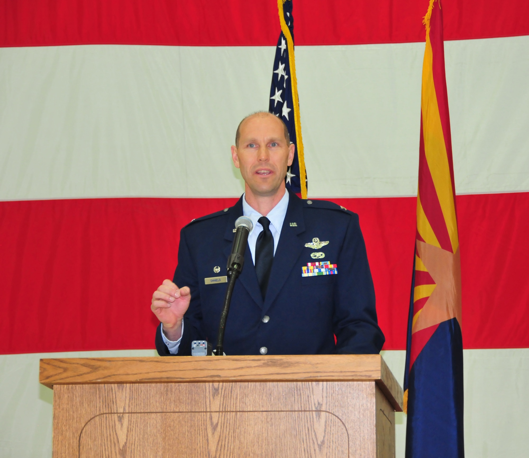 Col. Troy Daniels, commander of the 161st Air Refueling Wing, addresses the audience during the wing’s change of command ceremony at Phoenix Sky Harbor Air National Guard Base, Dec. 5. The change of command ceremony is rooted in military history, dating back to the 18th century. (U.S. Air National Guard photo by Master Sgt. Kelly Deitloff)
