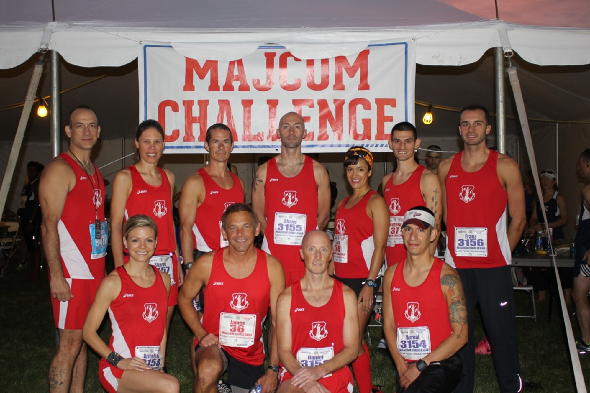 Maj. Sharon Ehasz (top, second left), 192nd Fighter Wing Equal Opportunity director, competed in the U.S. Air Force Marathon as a member of the Air National Guard MAJCOM challenge team on September 18, 2015 at the National Museum of the United States Air Force, Wright-Patterson Air Force Base, Ohio. The ANG team competed against 11 other Major Command teams and placed second overall in the challenge. (U.S. Air Force photo/Released)