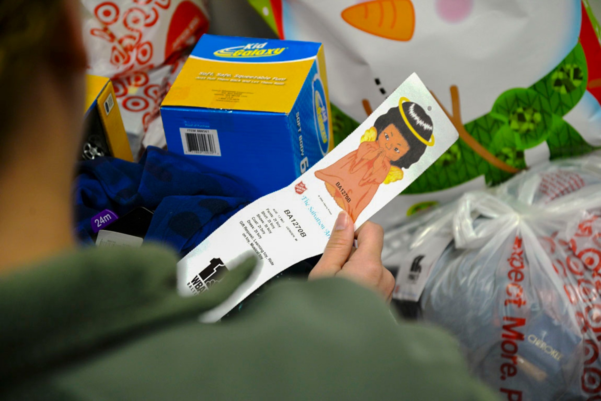 Tech. Sgt. Ashley Mooney, 175th Logistics Readiness Squadron unit training manager separates gifts for the Salvation Army Angel Tree Program Dec. 5, 2015 at Warfield Air National Guard Base, Baltimore, Md. Mooney was recognized for her continuing work with the Salvation Army Angel Tree Program since 2012. (U.S. Air National Guard photo by Airman 1st Class Enjoli Saunders/RELEASED)