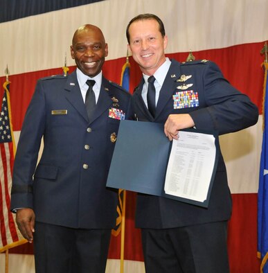 Nevada Air Guard Brig. Gen. Ondra Berry, left, presents Col. Karl Stark with the Outstanding Unit Award for the 152nd Airlift Wing. 152nd Airlift Wing was awarded a U.S. Air Force Outstanding Unit Award for the time period from October 2012 to October 2014. The U.S. Air Force announced the award earlier this year, but the Nevada Air National Guard publically announced it on Sunday during its annual awards ceremony at the base in Reno. 