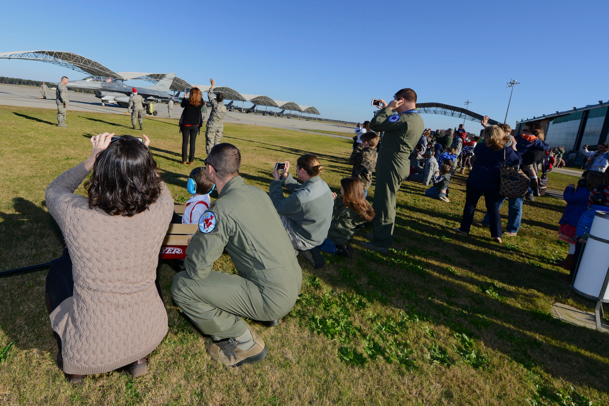 Swamp Fox Airmen and their families welcome the arrival of Santa Claus at McEntire Joint National Guard Base, S.C., Dec. 5, 2015.  Follow Santa as he travels the globe by visiting www.noradsanta.org.  (U.S. Air National Guard photo by Tech. Sgt. Jorge Intriago/Released)
