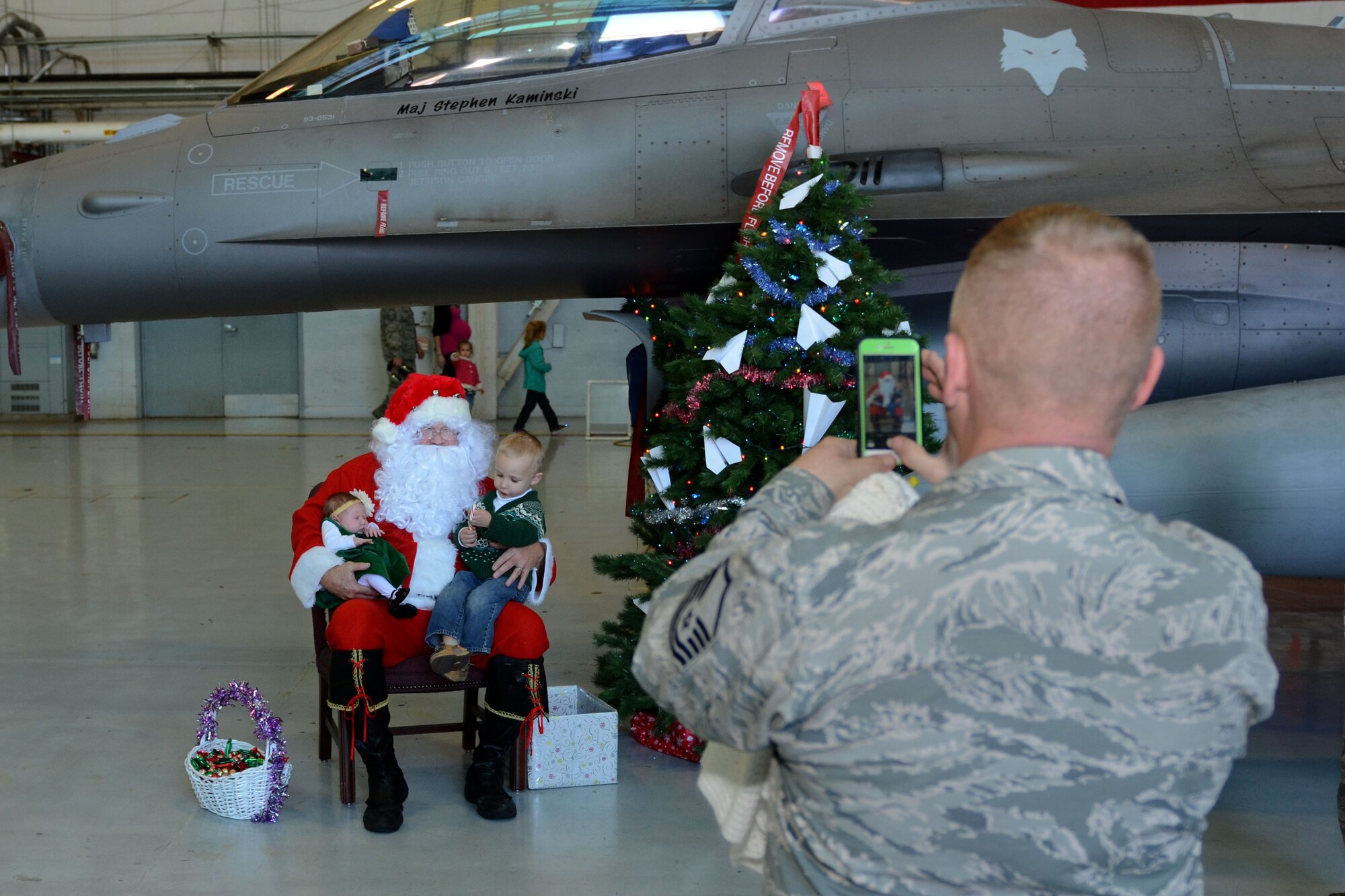 Swamp Fox Airmen and their families welcome the arrival of Santa Claus at McEntire Joint National Guard Base, S.C., Dec. 5, 2015.  Follow Santa as he travels the globe by visiting www.noradsanta.org.  (U.S. Air National Guard photo by Airman 1st First Class Ashleigh S. Pavelek/Released)