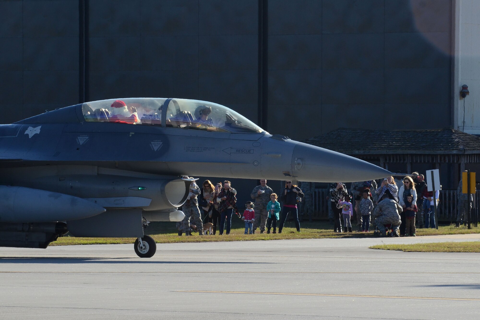 Swamp Fox Airmen and their families welcome the arrival of Santa Claus at McEntire Joint National Guard Base, S.C., Dec. 5, 2015.  Follow Santa as he travels the globe by visiting www.noradsanta.org.  (U.S. Air National Guard photo by Airman 1st First Class Ashleigh S. Pavelek/Released)