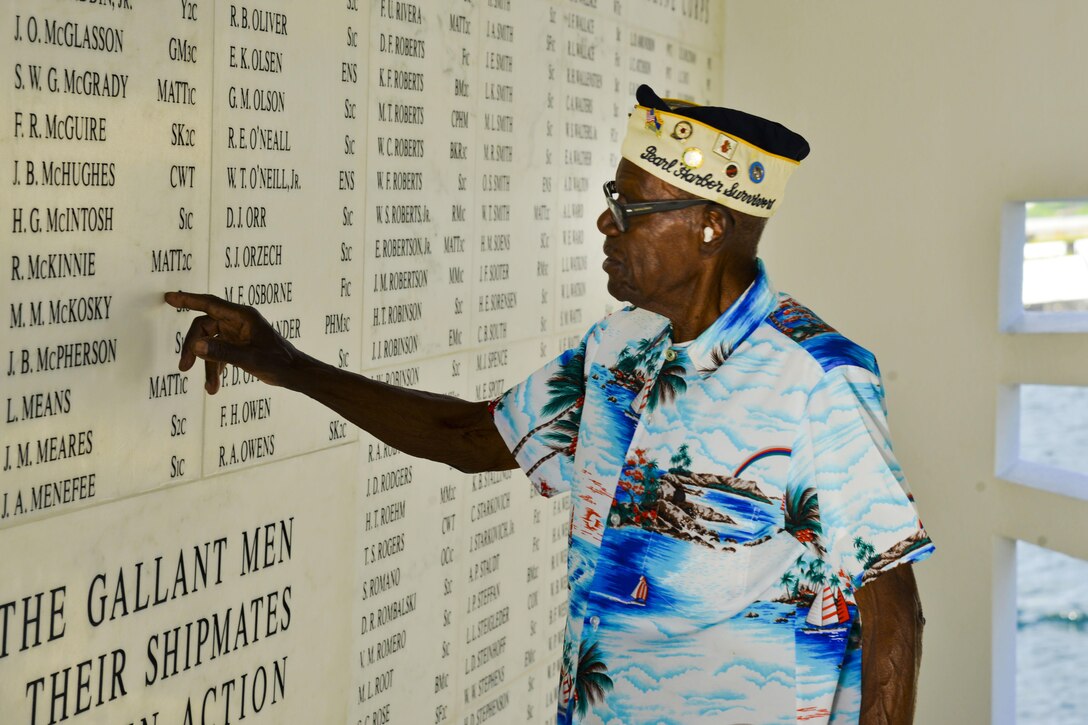 Navy veteran Nelson Mitchell, believed to be the oldest living African-American survivor of the attack on Pearl Harbor, reflects in the shrine room of the USS Arizona Memorial on Joint Base Pearl Harbor-Hickam, Hawaii, Dec. 5, 2015. Mitchell was attending a harbor tour in observance of the 74th anniversary of the Dec. 7, 1941, attack. U.S. Navy photo by Petty Officer 2nd Class Tamara Vaughn