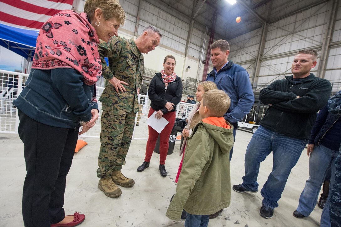 U.S. Marine Corps Gen. Joseph F. Dunford Jr., chairman of the Joint Chiefs of Staff, and his wife, Ellyn Dunford, talk with U.S. service members and their families after a USO show on Naval Air Station Sigonella, Italy, Dec. 5, 2015.  The chairman is visiting U.S. service members deployed overseas while bringing the 2015 USO Entertainment Troupe on a holiday tour to perform for U.S. troops in Europe, Africa and Asia. DoD photo by D. Myles Cullen
