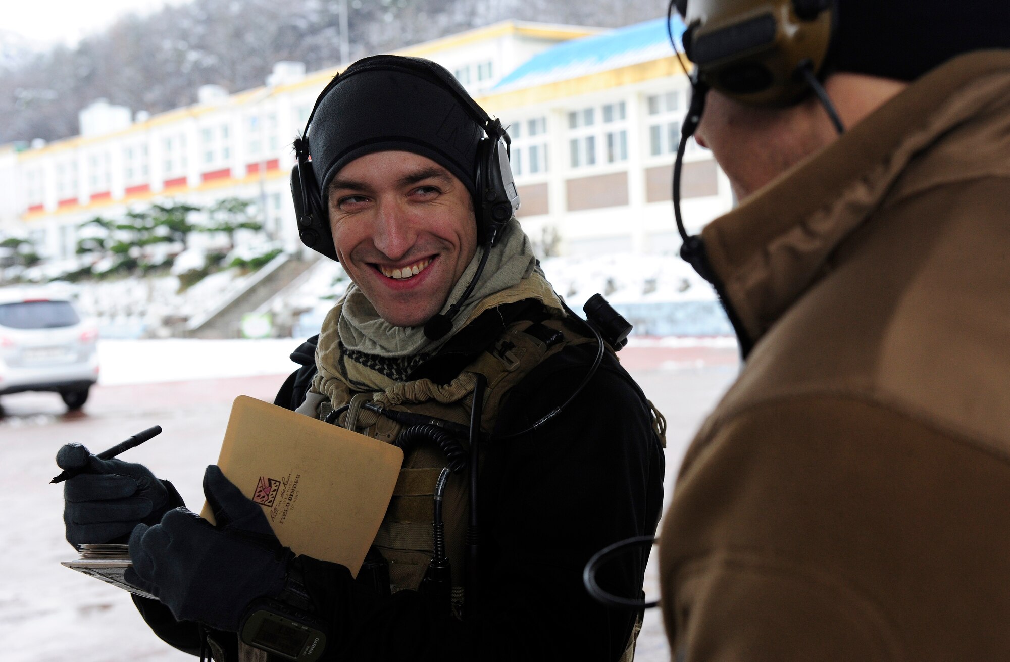 Senior Airman William Irvin, 604th Air Support Operations Squadron joint terminal air controller, shares a laugh with Staff Sgt. Stephen Stein, 604th ASOS JTAC, during Exercise Woody Cloud 16-1, Dec. 4, 2015. The scenarios the JTAC Airmen participated in involved close air support and counterinsurgency. (U.S. Air Force photo by Staff Sgt. Nick Wilson/Released)