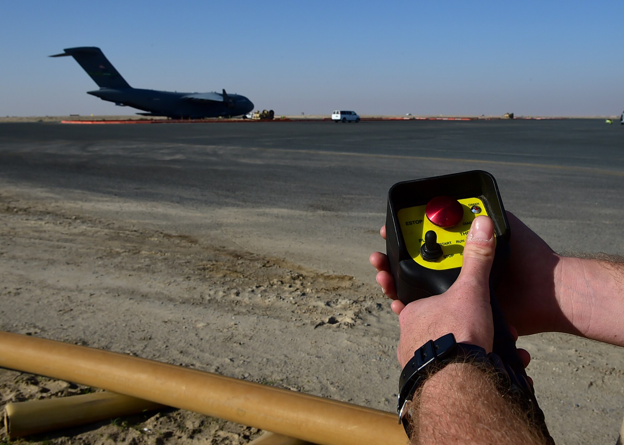 Staff Sgt. Brandon Wright, a 386th Expeditionary Logistics Readiness Squadron Fuels Ramp Operations NCO in charge, operates a hand-held R-20 Multi-servicing platform switch at an undisclosed location in Southwest Asia, Dec. 1, 2015. The Petroleum, Oils and Lubricants flight is responsible for providing fuel to all aircraft, and ground equipment for U.S. and coalition forces on base in support of Operation INHERENT RESOLVE. (U.S. Air Force photo by Staff Sgt. Jerilyn Quintanilla)