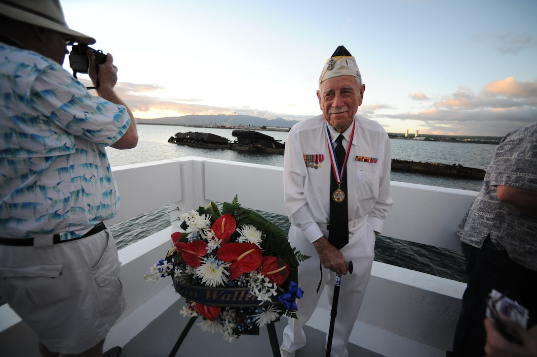 Delton “Wally” Walling, a Pearl Harbor survivor, poses for a photograph during the USS Utah Memorial sunset tribute on Ford Island, Pearl Harbor, Dec. 6, 2015. Several events will take place leading up to the 74th anniversary of Pearl Harbor Day to pay tribute to the nation’s military while enlightening Americans about veterans and service. U.S. Navy photo by Petty Officer 1st Class Meranda Keller