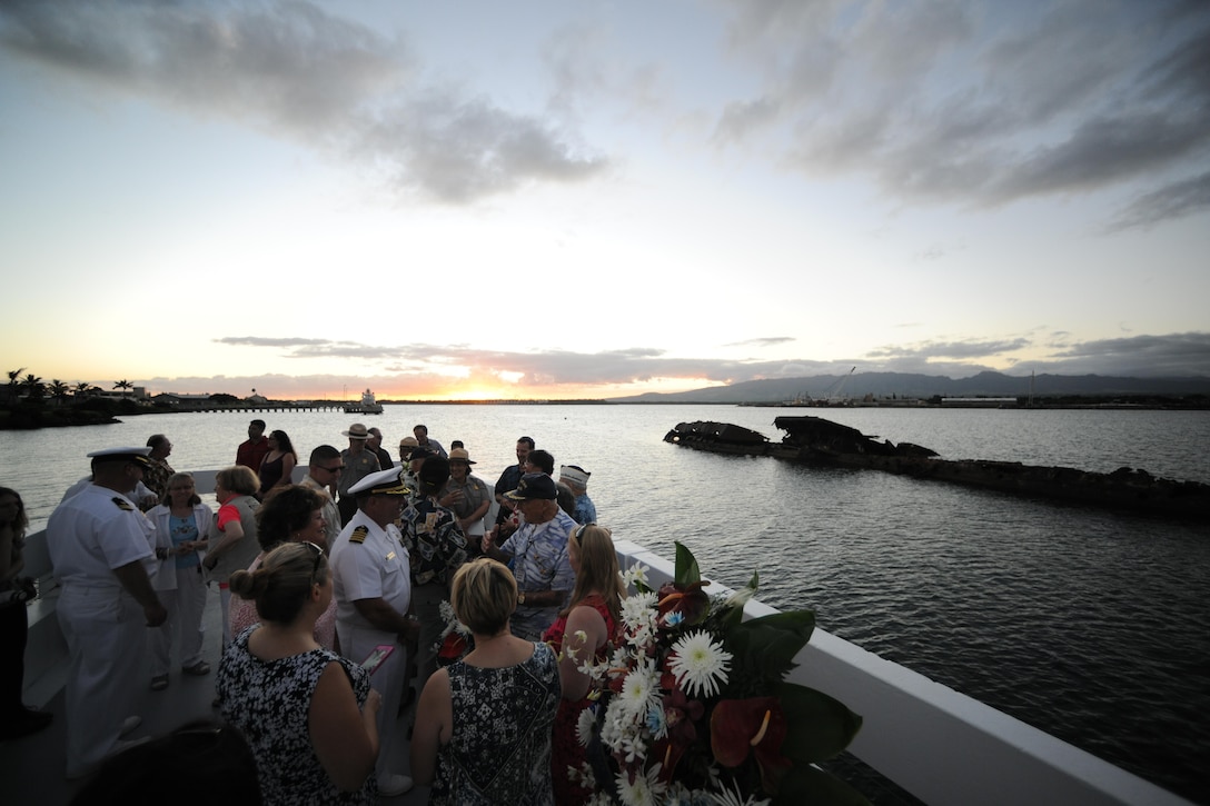 Pearl Harbor survivors speak with guests at the USS Utah Memorial sunset tribute on Ford Island, Pearl Harbor, Dec. 6, 2015. Several events will take place leading up to the 74th anniversary of Pearl Harbor Day to pay tribute to the nation’s military while enlightening Americans about veterans and service. U.S. Navy photo by Petty Officer 1st Class Meranda Keller