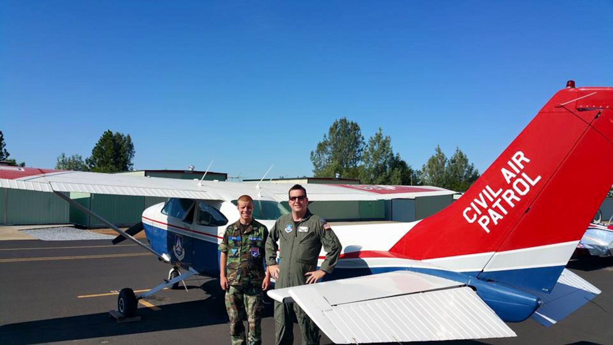Staff Sgt. Daniel Stein (right), 8th Expeditionary Air Mobility Squadron crew chief and his son Gregory (left), a Civil Air Patrol cadet. Gregory fractured his C-1 vertebrae in a severe all-terrain vehicle accident in November. He was flown to Sutter Health Roseville Medical Center in Roseville, California where he spent nine days in the Neuro-Intensive Care Unit. (U.S. Air Force photo courtesy of Staff Sgt. Daniel Stein)