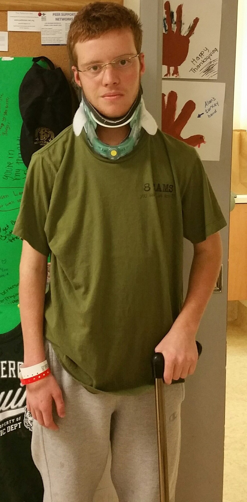 Gregory the son of, Staff Sgt. Daniel Stein, 8th Expeditionary Air Mobility Squadron crew chief poses for a photo at Santa Clara Valley Medical Center in San Jose, California. Gregory suffered a C-1 vertebrae fracture when an all-terrain vehicle he was operating flipped over. He is going through physical therapy treatment and able to walk with a cane. Gregory is scheduled to be released from the hospital Dec. 17th. (U.S. Air Force photo courtesy of Staff Sgt. Daniel Stein)