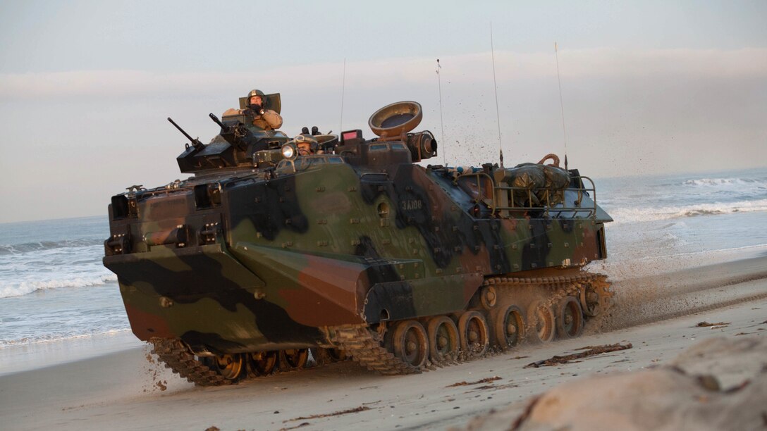 An amphibious assault vehicle proceeds to assault the objective after conducting an amphibious landing during Exercise Steel Knight aboard Marine Corps Base Camp Pendleton, Calif., Dec. 4, 2015. The U.S. Navy and Marine Corps continue to combine efforts to revitalize, refine and strengthen fundamental amphibious capabilities, and reinforce the Navy and Marine Corps team. Steel Knight will test  the Marine Air Ground-Task Force’s expeditionary capabilities through realistic, scenario-driven training. 