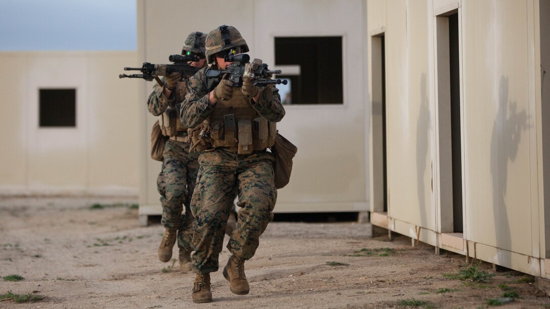 1st Battalion, 1st Marine Regiment infantrymen tactically move from building to building in a simulated combat zone during Exercise Steel Knight 2016 at Marine Corps Base Camp Pendleton, Calif., Dec. 4, 2015. 1st Marine Division has conducted Steel Knight for the past three years, making this the fourth iteration of the exercise. Steel Knight will test I Marine Expeditionary Force’s amphibious capabilities through realistic, scenario-driven training. 
