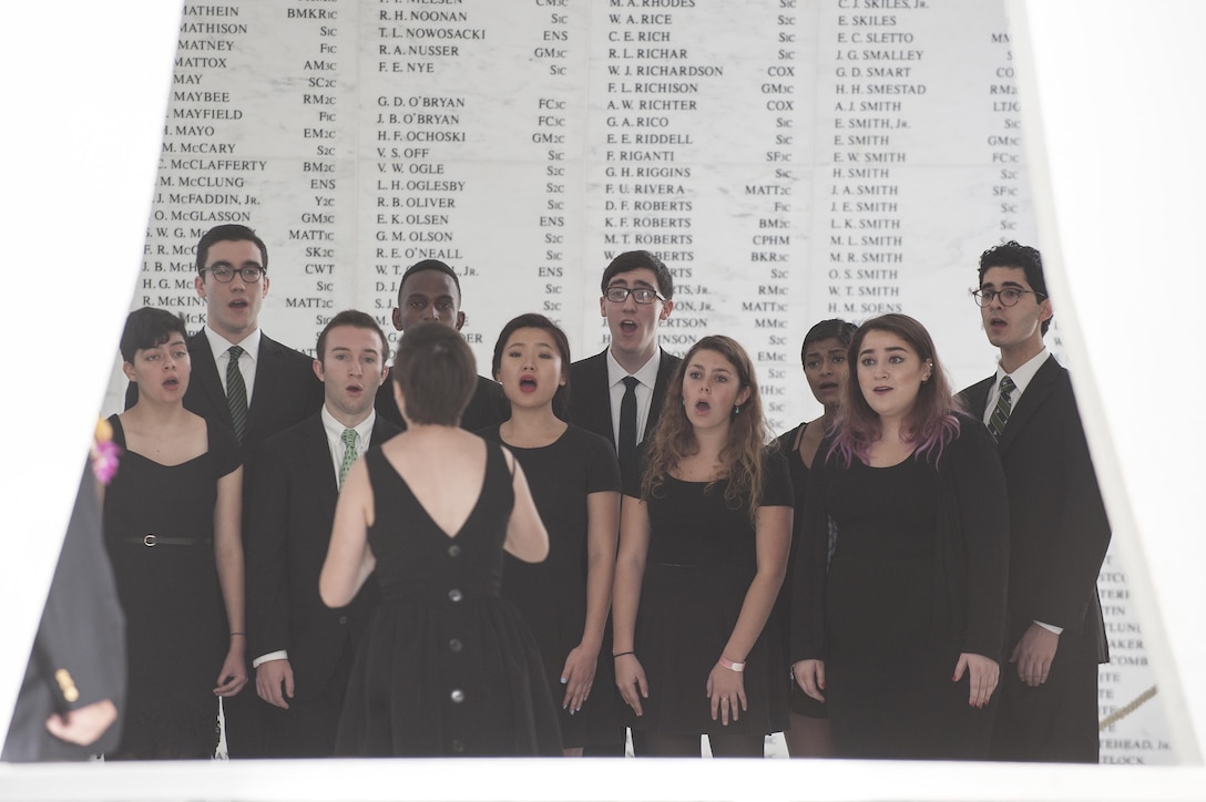 A Dartmouth College acapella choir performs during a Blackened Canteen ceremony as part of the 74th anniversary of Pearl Harbor Day Commemoration Anniversary at the USS Arizona Memorial, Hawaii, Dec. 6, 2015. U.S. Air Force photo by Staff Sgt. Christopher Hubenthal