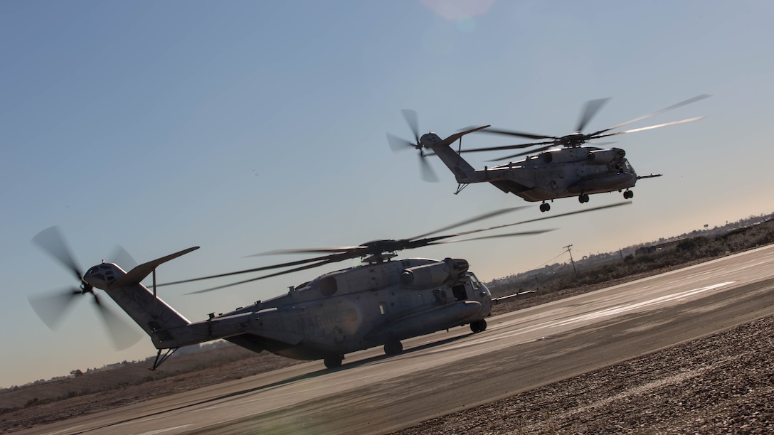Two CH-53E Super Stallions with Marine Heavy Helicopter Squadron 361 conduct Field Carrier Landing Practices aboard Marine Corps Air Station Miramar, Calif., Dec. 2, 2015. Marines with HMH-361 conducted section Confined Area Landings and Field Carrier Landing Practices to fulfill training requirements for landing aboard a Navy ship. 