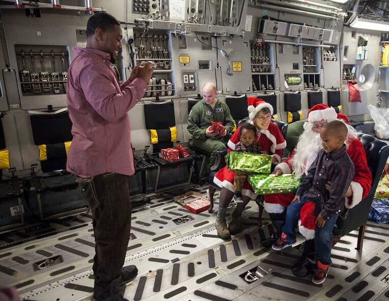 315th Operations Group members and their families got a very special opportunity to meet Santa and Mrs. Claus on a C-17 Globemaster III Saturday after the jolly couple  flew in from the North Pole. (U.S. Air Force photo by 2nd Lt. Rashard Coaxum)