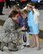 Senior Airman Monica Ricci shows photos to the great grand children on the General Oscar Westover the name sake for the base. They were special guests along with their parents for the Westover Air Show.