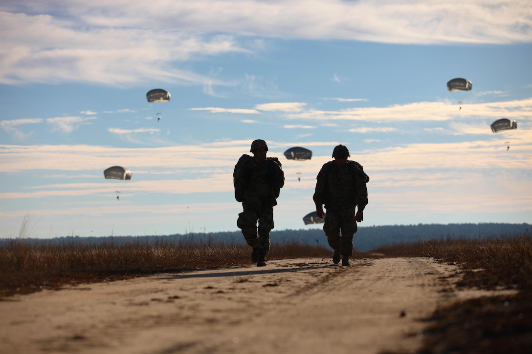 Paratroopers return after completing their jumps in participation for the 18th Annual Randy Oler Memorial Operation Toy Drop, hosted by U.S. Army Civil Affairs & Psychological Operations Command, Airborne, on Fort Bragg, N.C., Dec. 4, 2015. U.S. Army photo by Sgt. Neil Stanfield