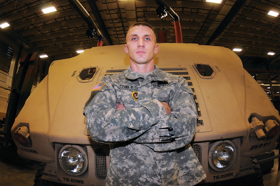 Army Sgt. 1st Class Chad Corey, an instructor assigned to the Basic Wheel Division, Wheel Maintenance Training Department, Ordnance School, at Fort Lee, Va., stands near a Humvee in the bay area of Stever Hall on the Ordnance Campus. Corey submitted an idea through the Supply and Maintenance Assessment and Review Team Program that could save the Army thousands of dollars in parts replacement costs for the vehicle and others. He was recognized for his suggestion by the Ordnance School leadership Nov.16 during an awards presentation. U.S. Army photo by Terrance Bell