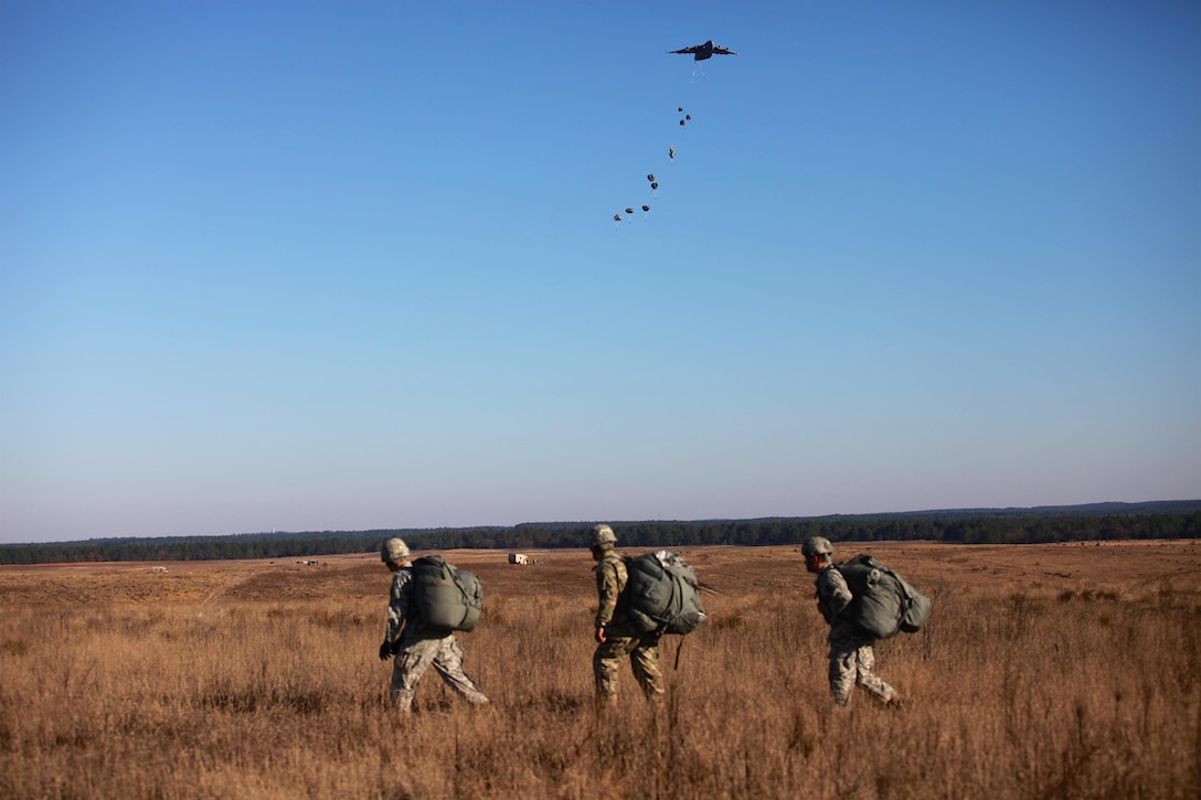 Paratroopers return after completing their jumps during the 18th Annual Randy Oler Memorial Operation Toy Drop, hosted by U.S. Army Civil Affairs & Psychological Operations Command, Airborne, on Fort Bragg, N.C., Dec. 4, 2015. U.S. Army photo by Sgt. Neil Stanfield