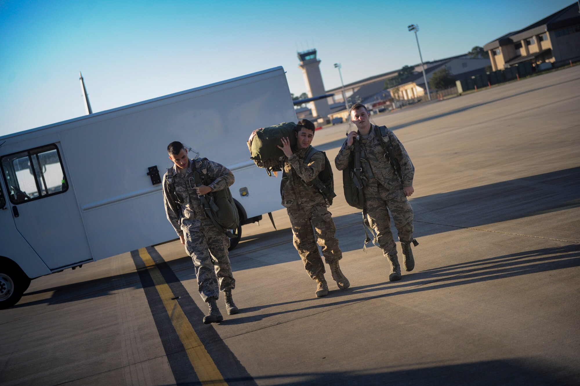 Airmen with the 4th Special Operations Squadron aircrew flight equipment shop swap out BA-22 parachutes during a pre-flight inspection of an AC-130U Spooky gunship at Hurlburt Field, Fla., Dec. 4, 2015. During pre-flight inspections, equipment is checked to ensure operability for each flight. (U.S. Air Force photo by Senior Airman Krystal M. Garrett)