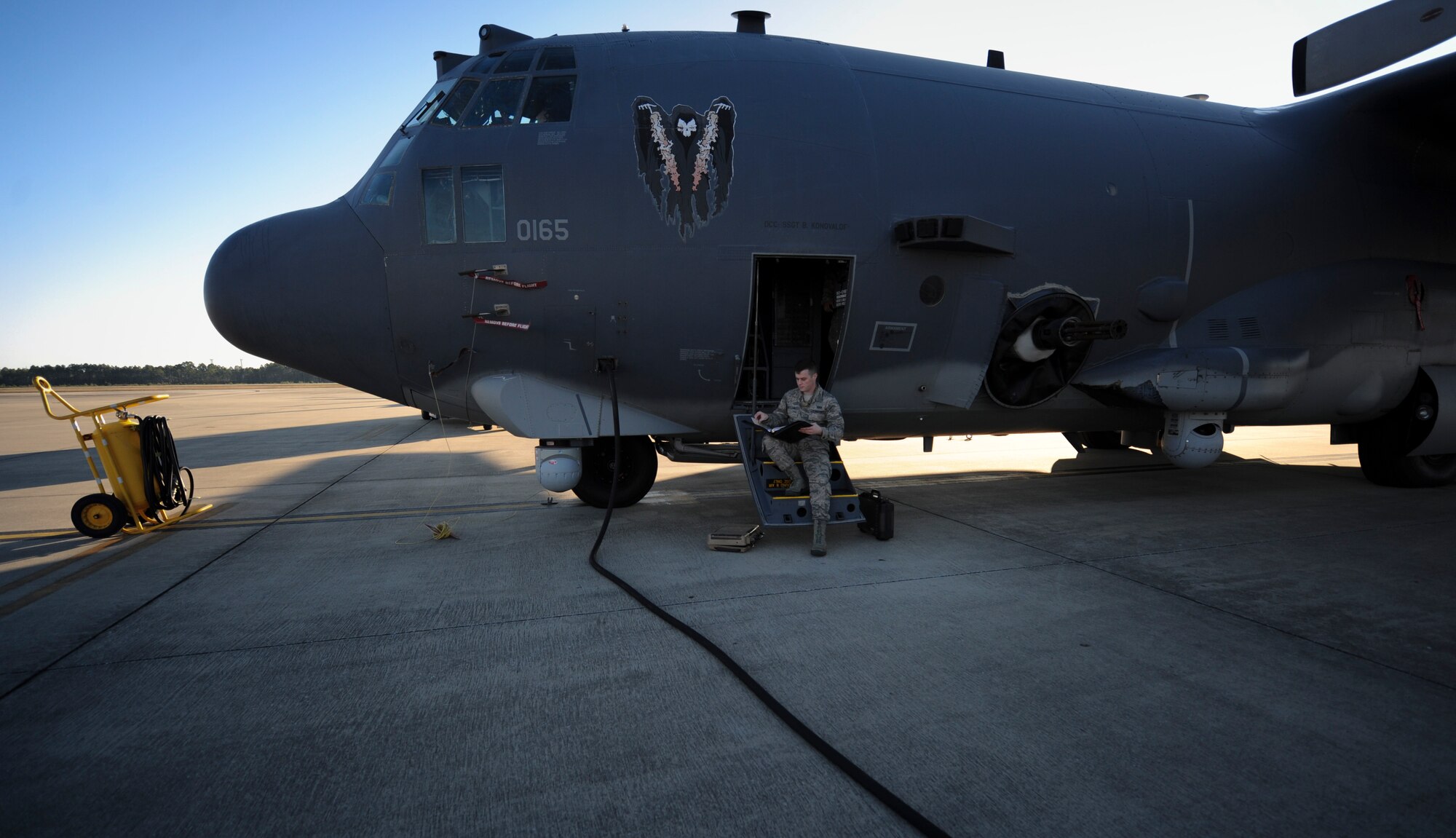 Airman 1st Class Cody Houston, an aircrew flight equipment apprentice with the 4th Special Operations Squadron, looks over an AFTO Form 46 during a pre-flight inspection Hurlburt Field, Fla., Dec. 4, 2015. An AFTO Form 46 states that all aircrew flight equipment is up to date. (U.S. Air Force photo by Senior Airman Krystal M. Garrett)