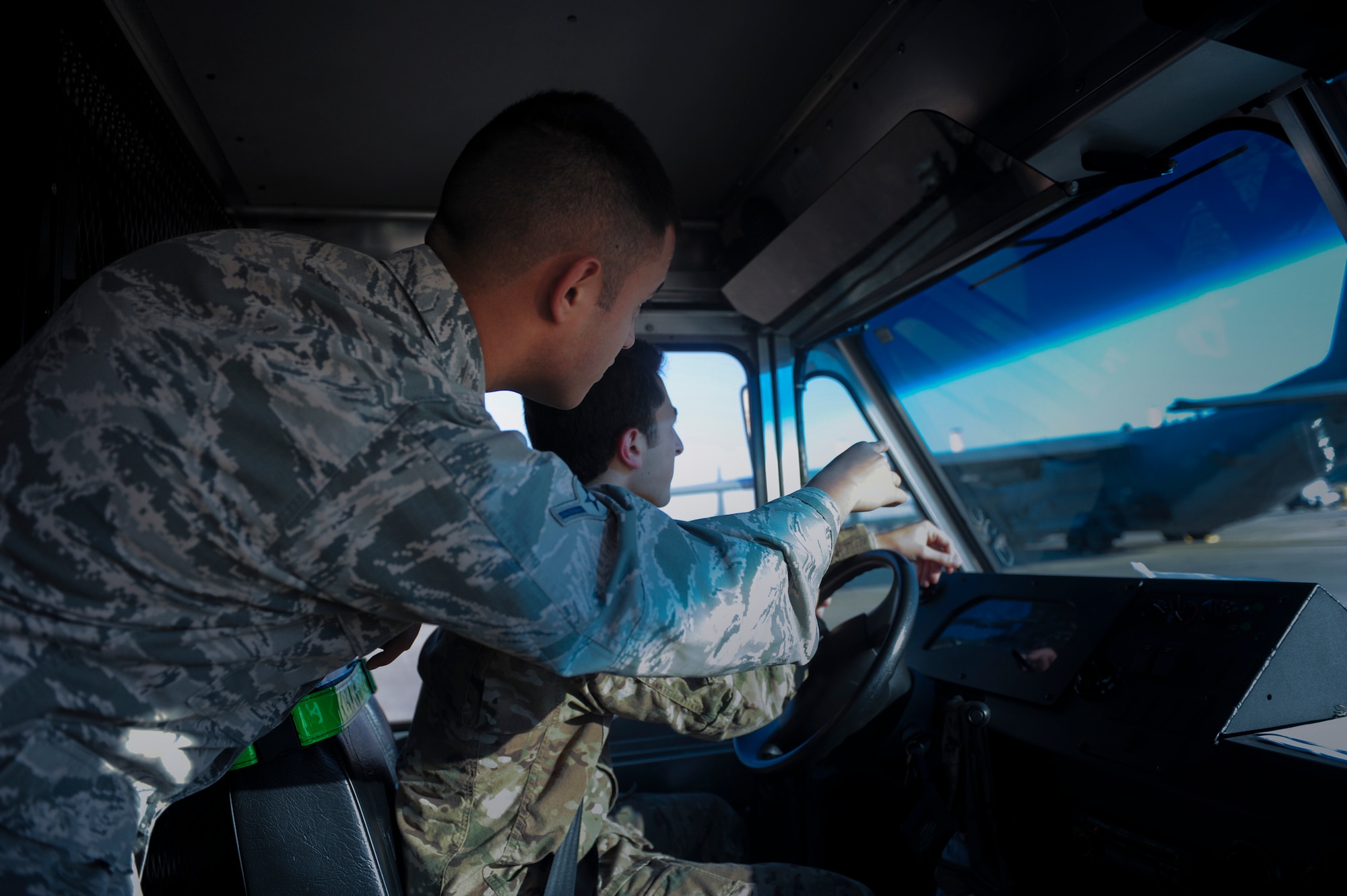 Airman Nicholas Tweet, an aircrew flight equipment apprentice with the 4th Special Operations Squadron, directs Senior Airman James Tovar, an aircrew flight equipment journeyman with the 4th SOS, to an AC-130U Spooky gunship for a pre-flight inspection at Hurlburt Field, Fla., Dec. 4, 2015. Pre-flight inspections are done prior to take-off to ensure all equipment has been inspected is current. (U.S. Air Force photo by Senior Airman Krystal M. Garrett)
