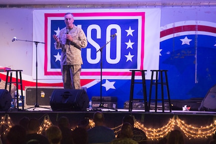 US Marine Gen. Joseph F. Dunford Jr., chairman of the Joint Chiefs of Staff, addresses the audience of deployed US service members before a USO show in Camp Lemonnier, Djibouti on Dec 6, 2015. The Chairman, along with members of the 2015 USO Entertainment Troupe, are visiting service members and their families to express the country's gratitude for their service while deployed during the Holidays in defense our Nation. 