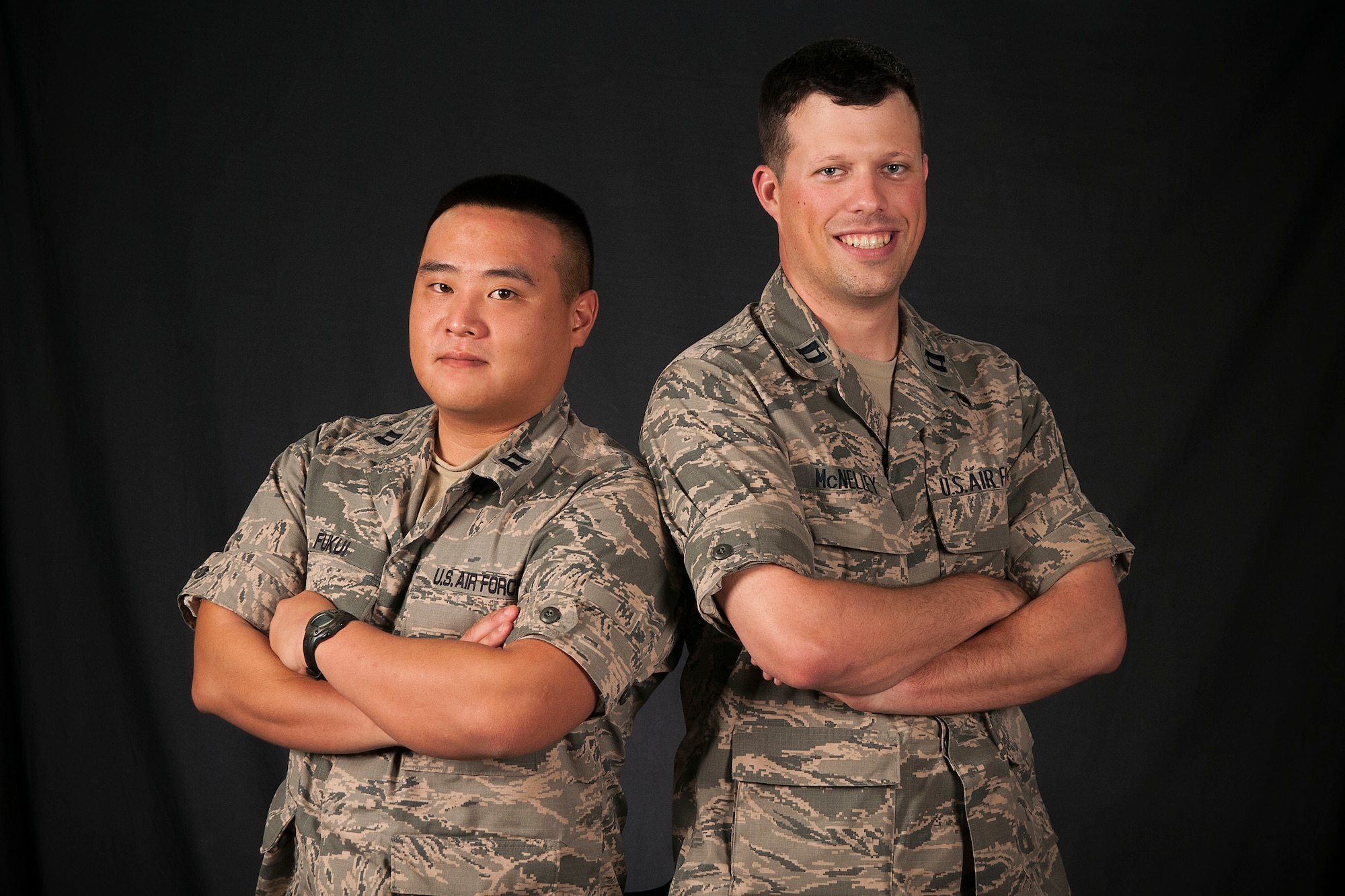 Capts. Christopher Fukui and Joshua McNelley are assigned to the 18th Logistics Readiness Squadron at Kadena Air Base, Japan. Both Airmen are descendants of sailors who fought in the Battle of Midway during World War II. Fukui’s great-grandfather, Chisato Morita, commanded the Imperial Japanese Navy Midway Flying Corps aboard the aircraft carrier Akagi and McNelley’s grandfather, Ray Sorton, a U.S. Navy Sailor, manned an anti-aircraft gun during the battle. (U.S. Air Force photo/Senior Airman John Linzmeier)