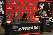 Sgt. Michael Capasso speaks at Eden Prairie high School before awarding local athlete, J. D. Spielman, an honorary game jersey for the Semper Fi All American Bowl. The SFAAB is the Marine Corps' own high school football bowl, which pits 100 of the best and brightest young athletes in the nation against each other. Those who are chosen to play in the SFAAB are selected based on their performance on the football field, and their character off the field.
