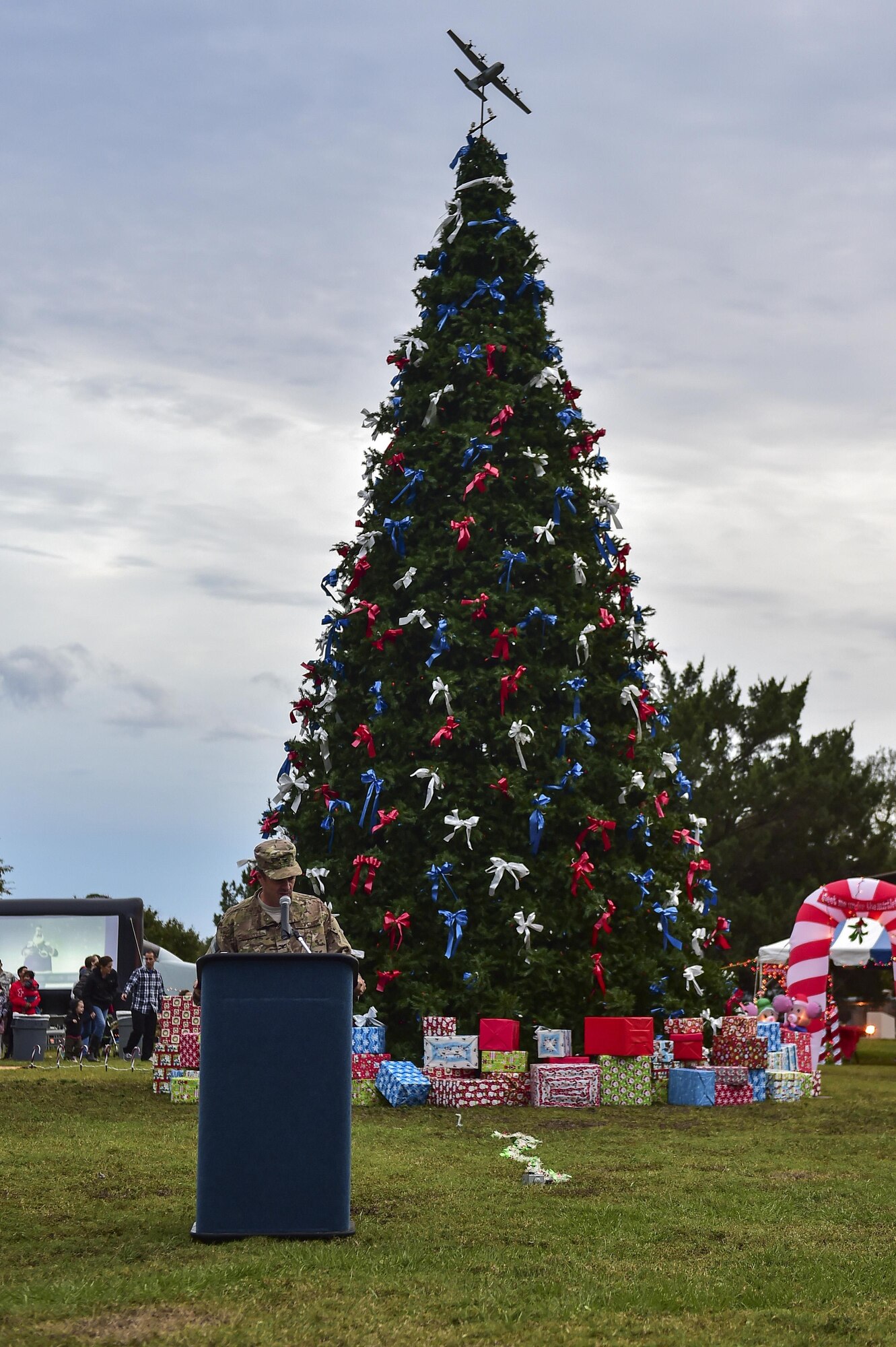 Col. Sean Farrell, the commander of the 1st Special Operations Wing, addresses Air Commandos and their families during the annual Christmas tree lighting ceremony at Hurlburt Field, Fla., Dec. 2, 2015. “The holidays are a time for all Air Commandos and their families to reflect on the blessings we share, particularly the peace we enjoy because of the selfless work and dedication of our armed forces and our Airmen.” Farrell said. “Let’s ask for one more blessing -- the safe return of all our deployed Airmen, may we focus all our thoughts on them, their families and each other during this wonderful holiday season.” (U.S. Air Force by Senior Airman Jeff Parkinson)