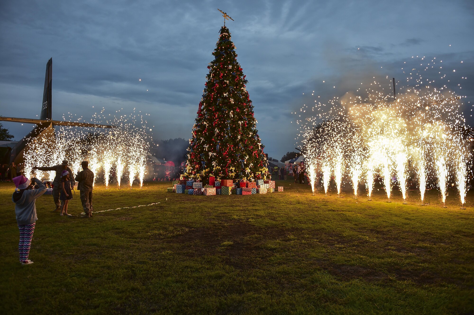 The Hurlburt Field Christmas tree lighting is accompanied by a fireworks display during the annual Christmas tree lighting ceremony at Hurlburt Field, Fla., Dec. 2, 2015. The ceremony is traditionally followed by a winter wonderland celebration at the youth center. This year, winter wonderland was also held at the air park. (U.S. Air Force photo by Senior Airman Jeff Parkinson)
