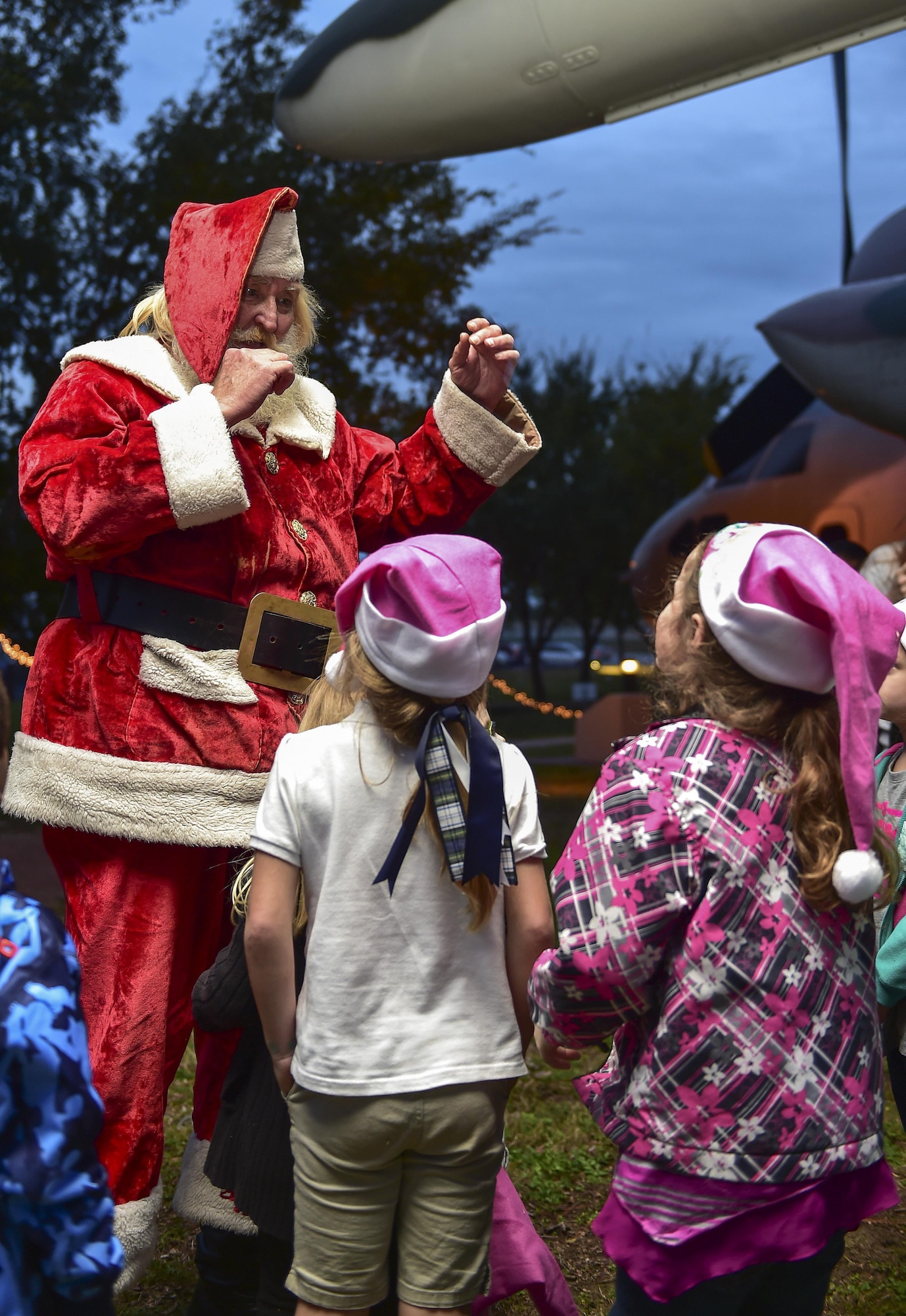 Santa Claus interacts with children during the annual Christmas tree lighting ceremony at Hurlburt Field, Fla., Dec. 2, 2015. The ceremony happens every year at the air park in the beginning of December to celebrate the holiday season. (U.S. Air Force photo by Senior Airman Jeff Parkinson)