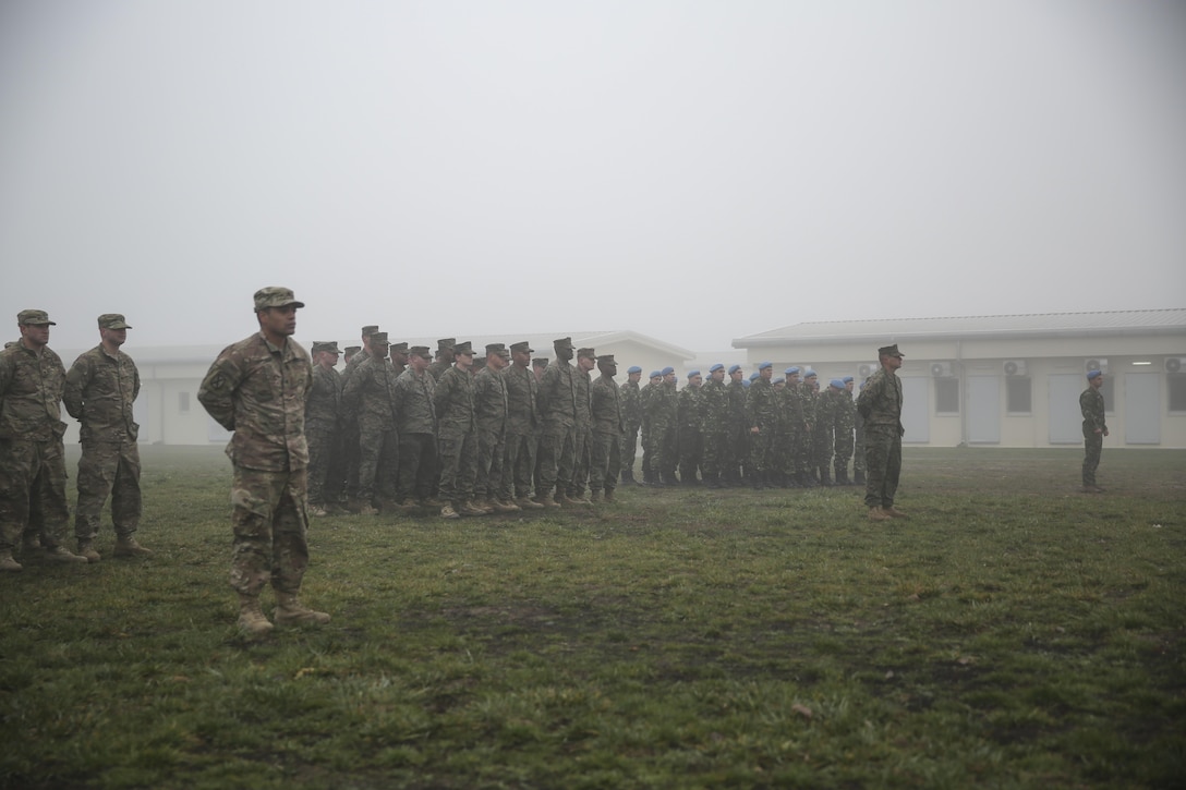 U.S. soldiers, U.S. Marines, and Romanian soldiers stand in formation to commemorate the 74th anniversary of the attack on Pearl Harbor during a ceremony on Mihail Kogalniceanu Air Base, Romania, Dec. 7, 2015. U.S. Marine Corps photo by Cpl. Kaitlyn V. Klein
