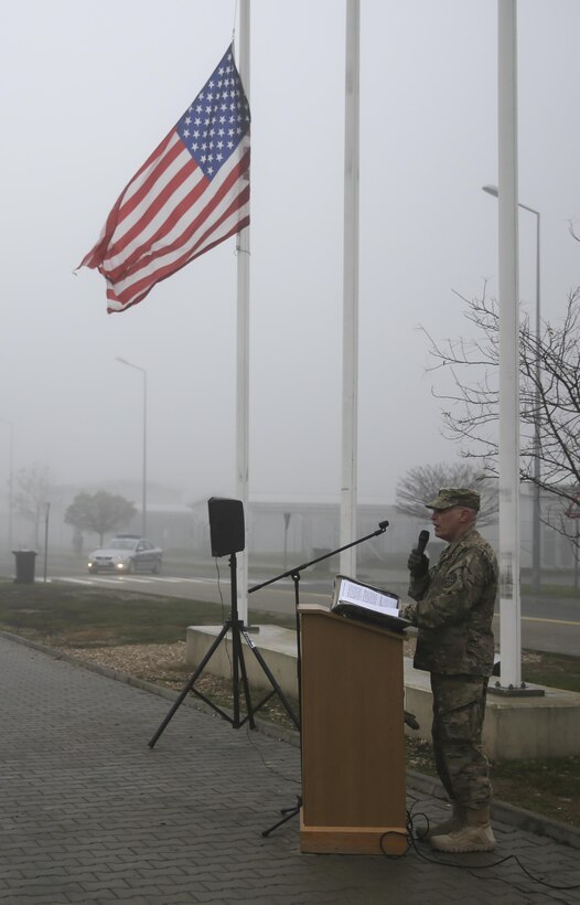 A U.S. soldier speaks to U.S. and Romanian troops commemorating the 74th anniversary of the attack on Pearl Harbor during a ceremony on Mihail Kogalniceanu Air Base, Romania, Dec. 7, 2015. U.S. Marine Corps photo by Cpl. Kaitlyn V. Klein