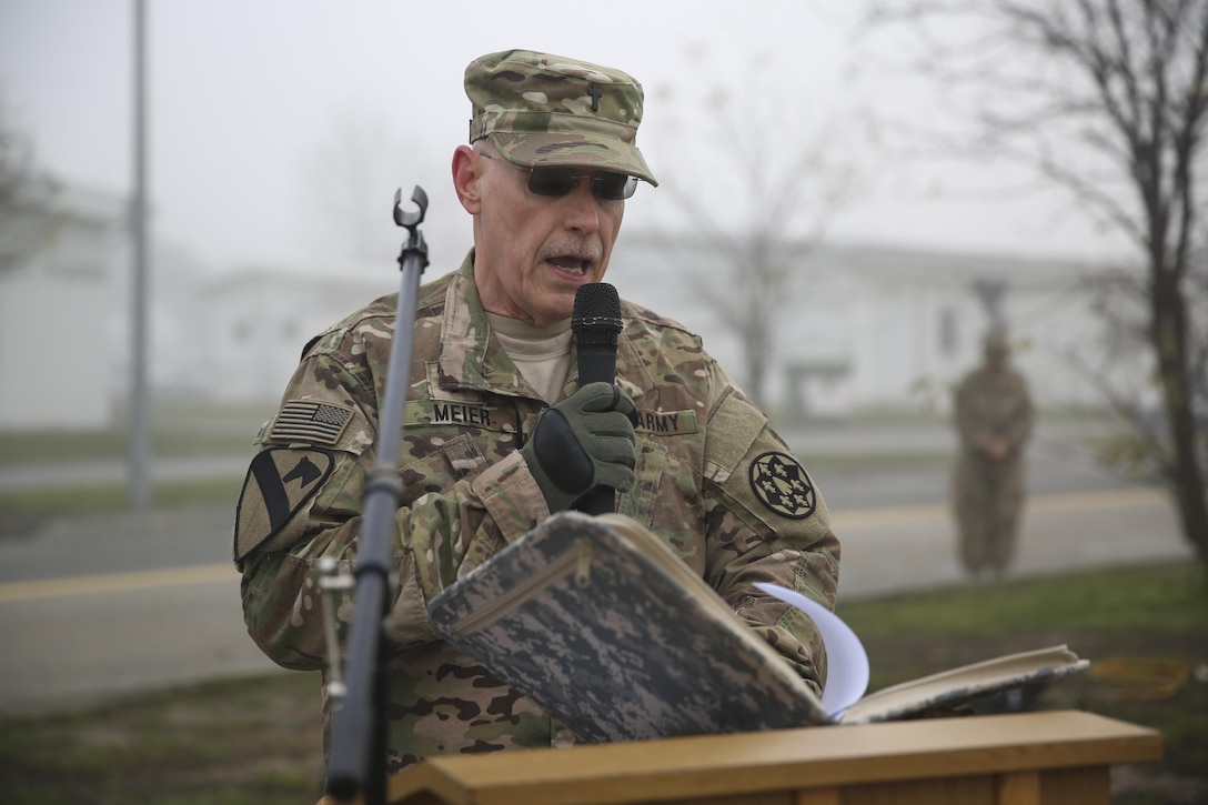 A U.S. Army chaplain speaks to U.S. and Romanian troops commemorating the 74th anniversary of  the attacks on Pearl Harbor during a ceremony on Mihail Kogalniceanu Air Base, Romania, Dec. 7, 2015. U.S. Marine Corps photo by Cpl. Kaitlyn V. Klein