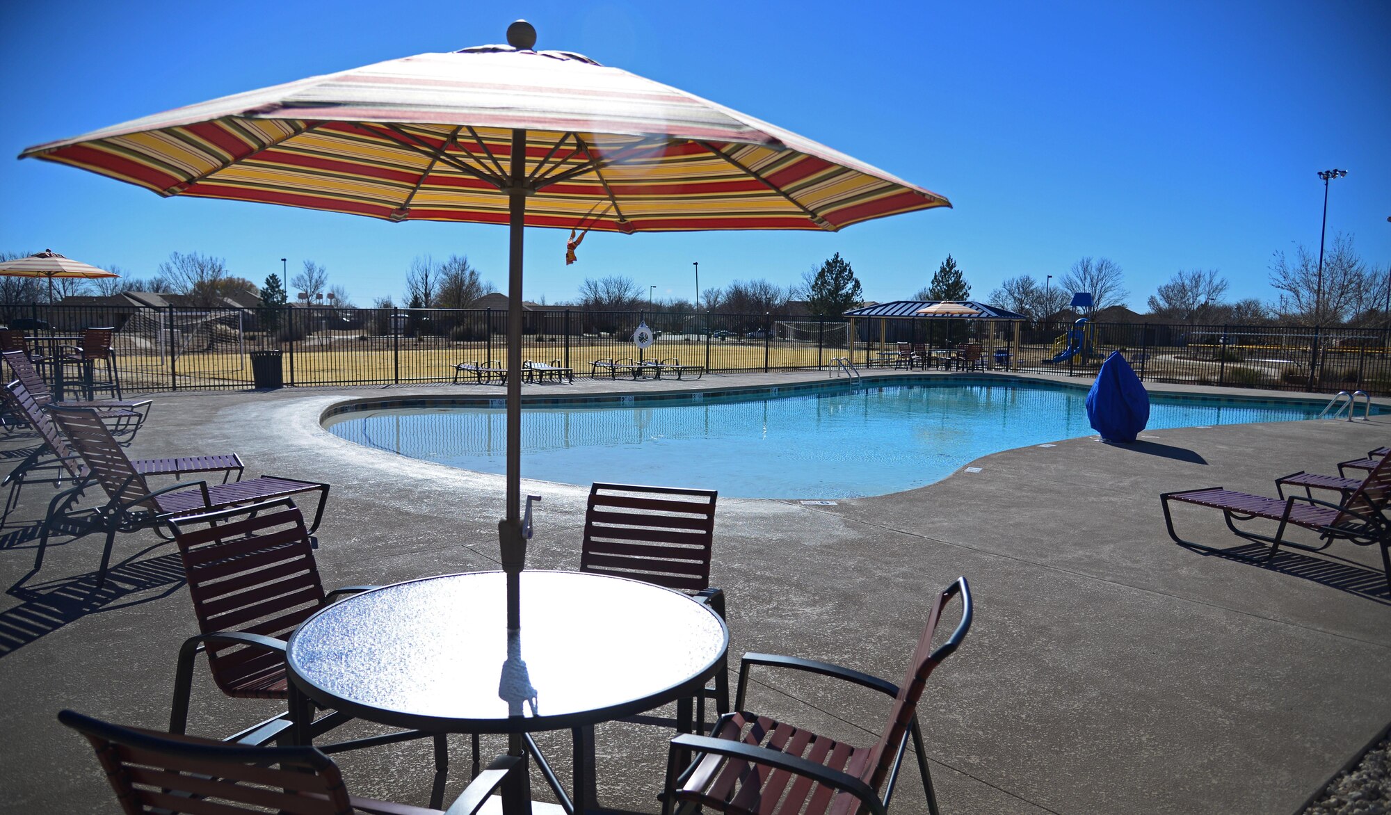 Courtesy photo of the new Balfour Beatty Communities community center pool located in the Chavez Housing area just off Cannon Air Force Base, N.M. The facility also features sand volleyball courts, baseball diamond and even a small fitness room complete with children’s play area. (U.S. Air Force photo/Staff Sgt. Alexx Pons)