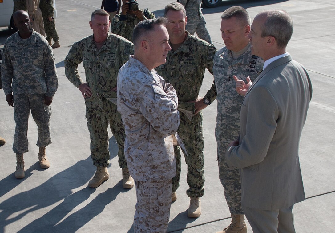 U.S. Marine Gen. Joseph F. Dunford Jr., chairman of the Joint Chiefs of Staff; Tom Kelly, U.S. ambassador to Djibouti; and U.S. Army Maj. Gen. Mark Stammer, commander of Combined Joint Task Force Horn of Africa, greet one another upon Dunford's arrival in Djibouti, Dec. 6, 2015.. DoD photo by D. Myles Cullen
