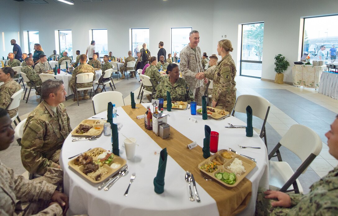 U.S. Marine Gen. Joseph F. Dunford Jr., chairman of the Joint Chiefs of Staff, and his wife, Ellyn, share dinner with U.S. service members serving in Djibouti, Dec 6, 2015. DoD photo by D. Myles Cullen