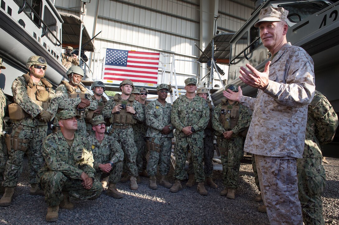 U.S. Marine Gen. Joseph F. Dunford Jr., chairman of the Joint Chiefs of Staff, talks with U.S. sailors during his visit on Camp Lemonnier, Djibouti, Dec 6, 2015.  Dunford is traveling with entertainers to visit U.S. service members overseas during the 2015 USO Holiday Tour. DoD photo by D. Myles Cullen