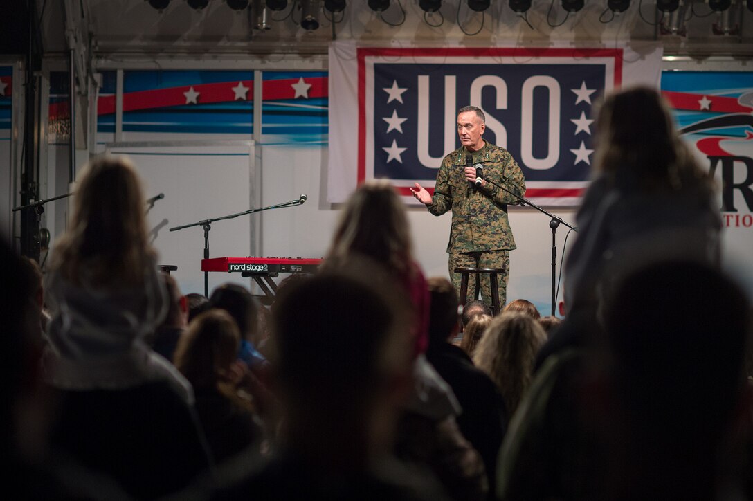 U.S. Marine Gen. Joseph F. Dunford Jr., chairman of the Joint Chiefs of Staff, addresses service members and their families at the beginning of a USO show on Naval Air Station Sigonella, Italy, Dec. 5, 2015. DoD photo by D. Myles Cullen