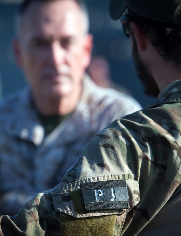 U.S. Marine Gen. Joseph F. Dunford Jr., chairman of the Joint Chiefs of Staff, talks with a U.S. airman during a visit on Camp Lemonnier, Djibouti, Dec 6, 2015. DoD photo by D. Myles Cullen