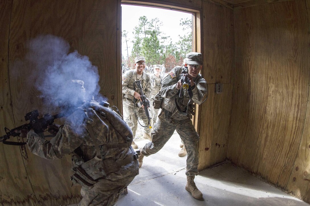 Soldiers react to contact while rehearsing room clearance procedures at the Urban Assault Course on Fort Jackson, S.C., Dec. 3, 2015. The soldiers are assigned to Company B, 2nd Battalion, 39th Infantry Regiment. U.S. Army photo by Sgt. 1st Class Brian Hamilton