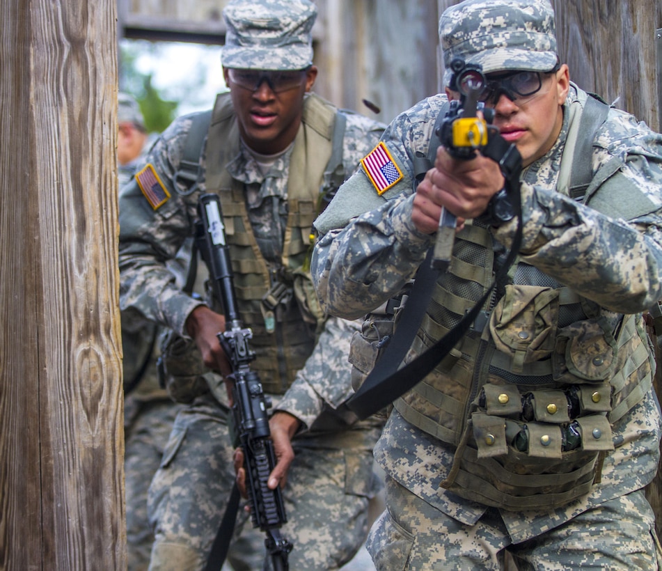 Soldiers engage the opposing force while conducting a room clearance at the Urban Assault Course on Fort Jackson, S.C., Dec. 3, 2015. U.S. Army photo by Sgt. 1st Class Brian Hamilton
