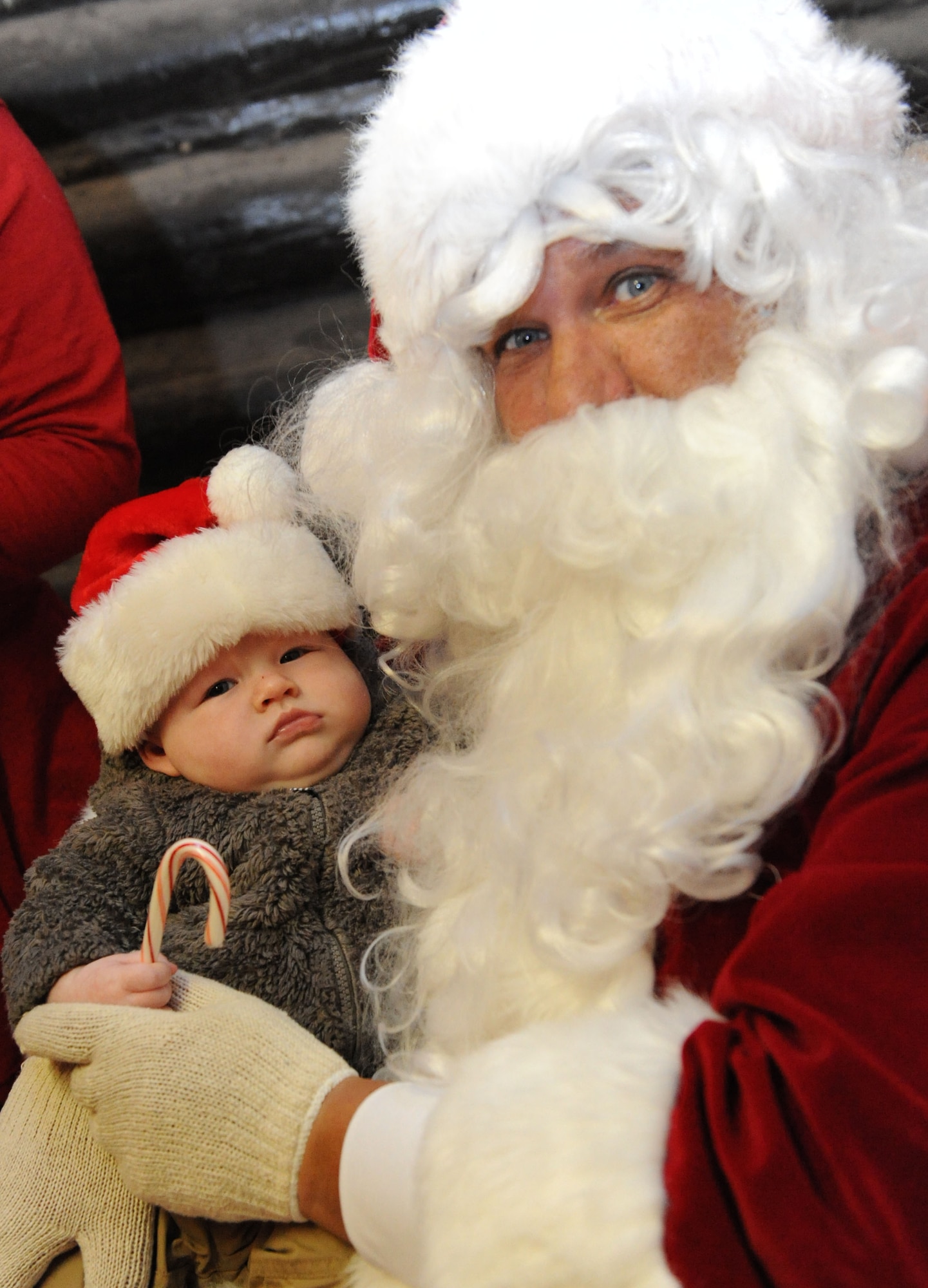Santa Claus visits with Levi, son of Capt. Katie Mueller, 81st Medical Operations Squadron physician assistant, during Keesler’s annual Christmas in the Park celebration at marina park Dec. 3, 2015, Keesler Air Force Base, Miss. The event, hosted by Outdoor Recreation, included a tree lighting ceremony, tour train rides, holiday music, and cookie and ornament decorating. (U.S. Air Force photo by Kemberly Groue)