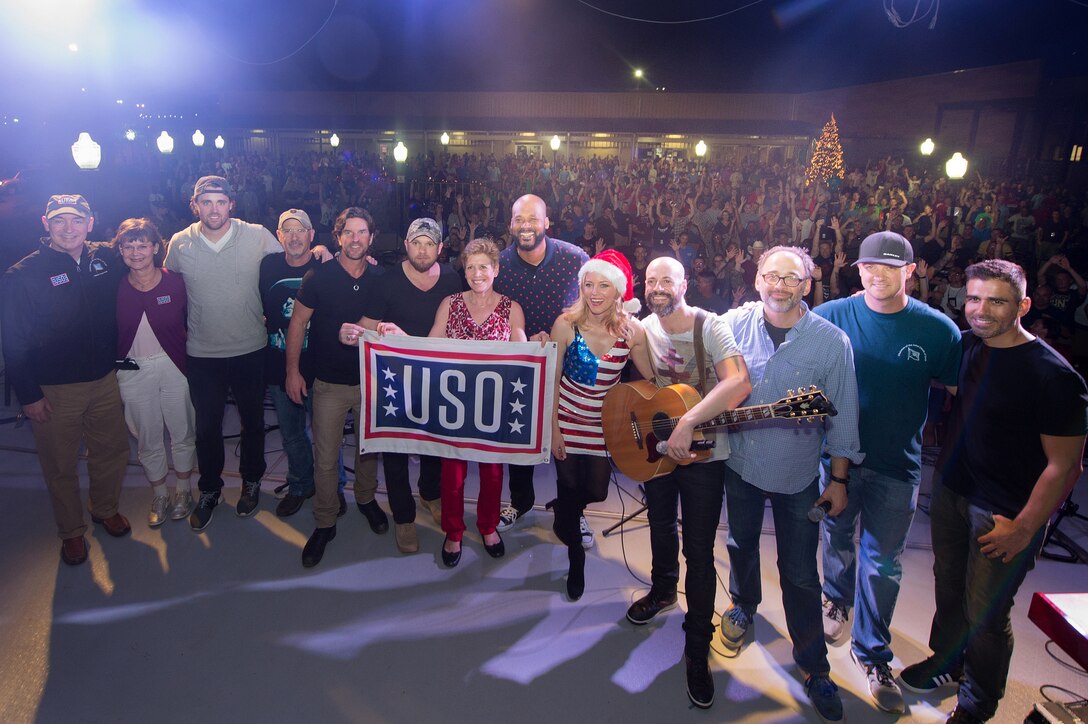Ellyn Dunford, wife of U.S. Marine Corps Gen. Joseph F. Dunford Jr., chairman of the Joint Chiefs of Staff, poses with USO entertainers at the end of a show on Camp Lemonnier, Djibouti, Dec 6, 2015. DoD photo by D. Myles Cullen