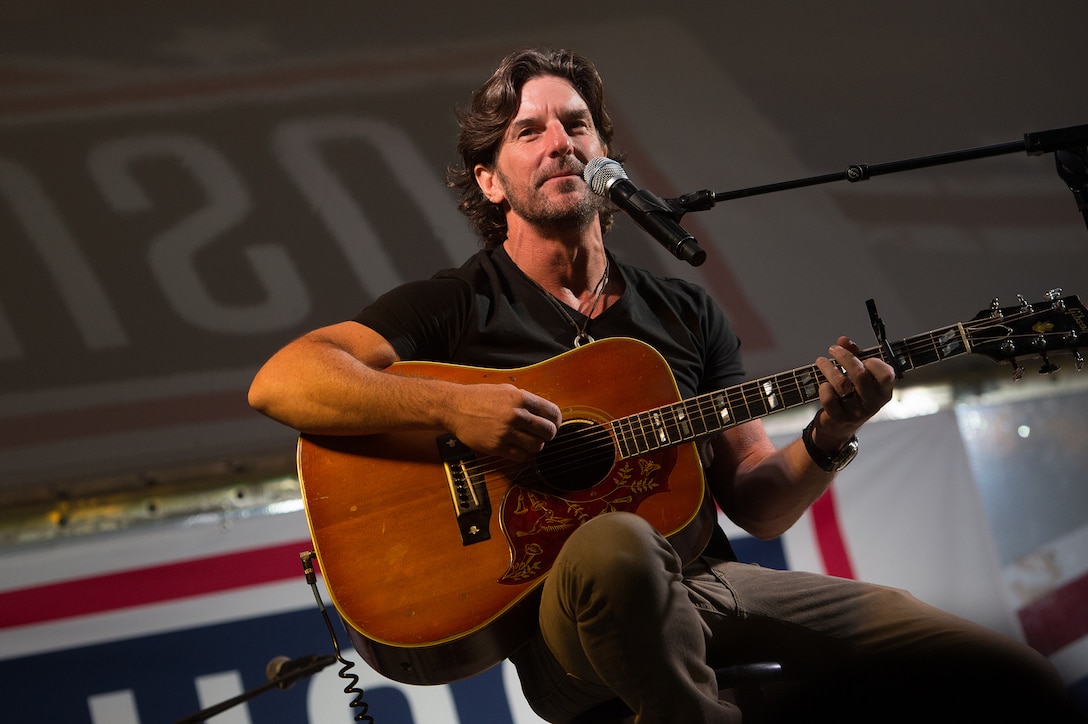 Brett James, singer and songwriter, performs during a USO show for US service members deployed on Camp Lemonnier, Djibouti, Dec 6, 2015.  DoD photo by D. Myles Cullen
